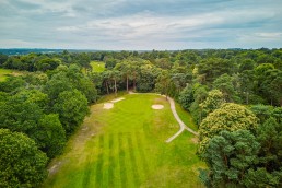 Wide angle aerial view of the 14th green at Addington Palace Golf Club